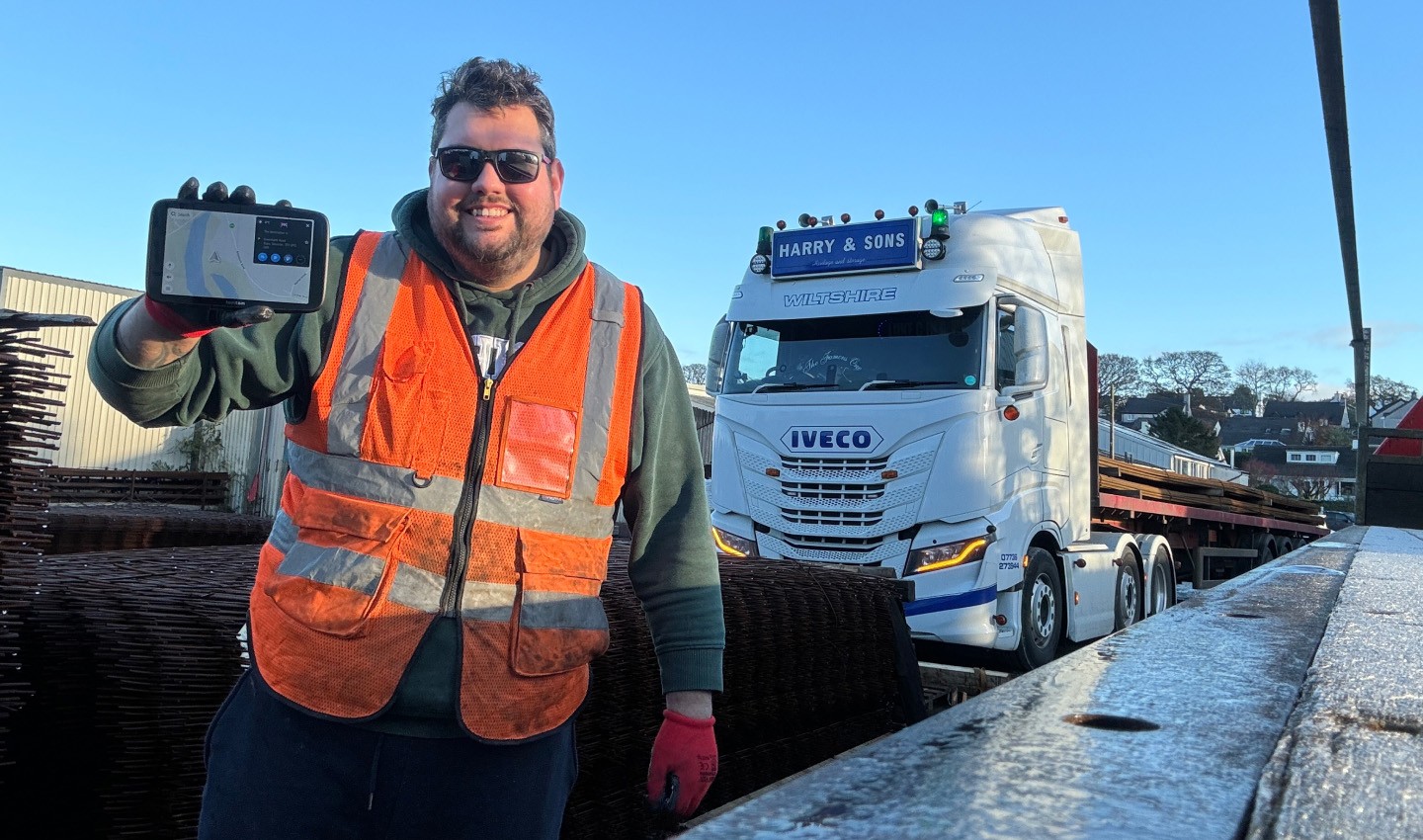 Truck driver, Luke C in a HGV, with his TomTom navigation device and beloved truck.