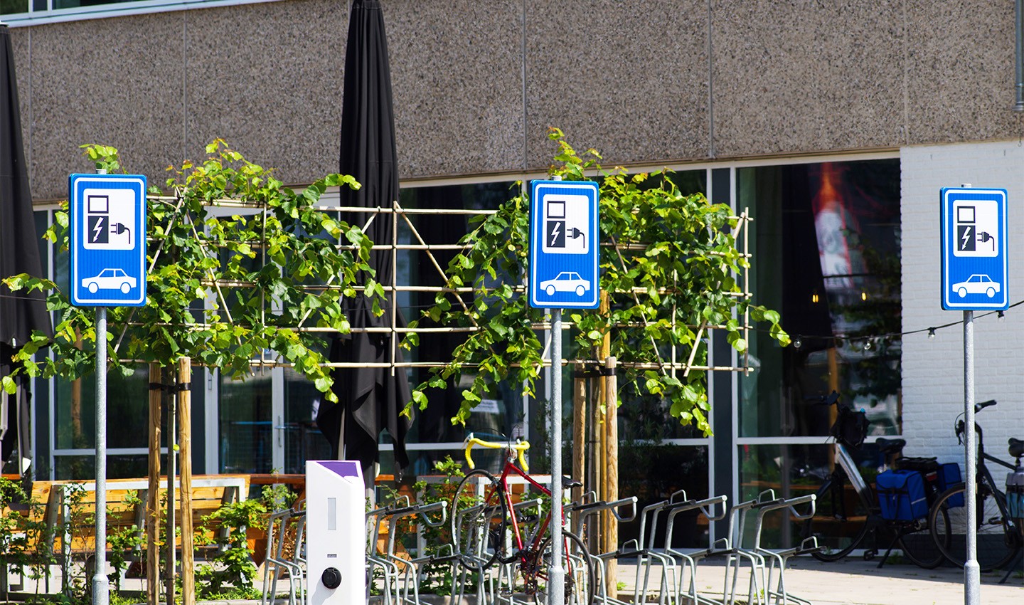 three EV charging stations next to each other in the Netherlands